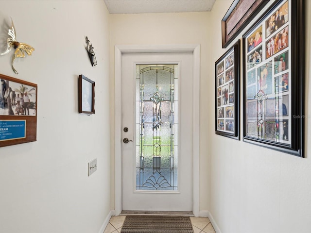 11536 Golden Rain Dr, New Port Richey, FL 34654 - entryway featuring baseboards and light tile patterned floors