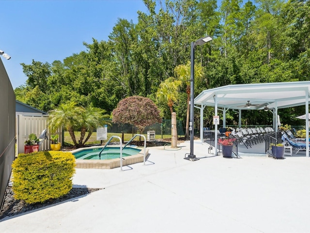 11536 Golden Rain Dr, New Port Richey, FL 34654 - view of swimming pool with a hot tub, a patio area, a ceiling fan, fence, and a gazebo