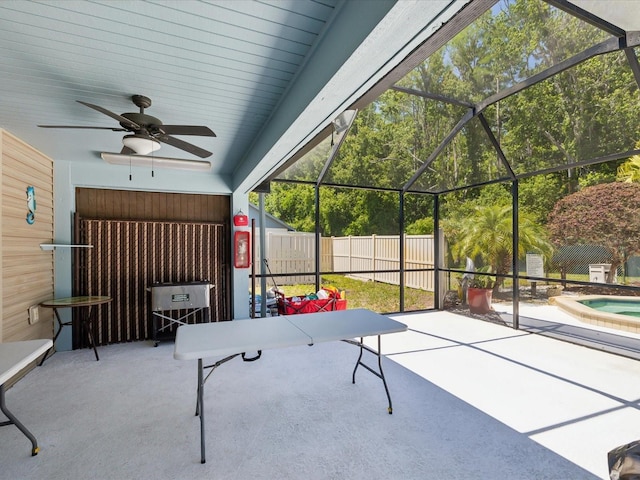 11536 Golden Rain Dr, New Port Richey, FL 34654 - view of patio with fence, an in-ground hot tub, a ceiling fan, and a lanai