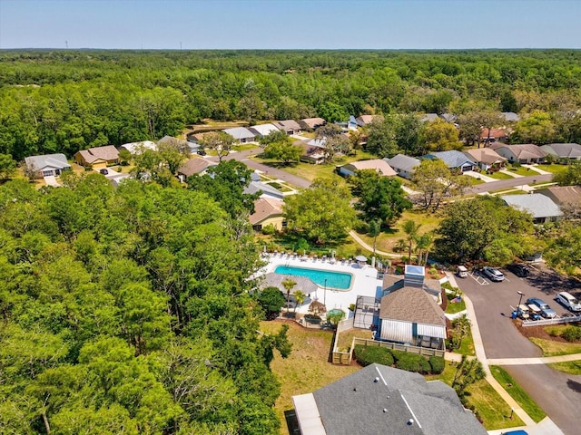 11536 Golden Rain Dr, New Port Richey, FL 34654 - aerial perspective of suburban area with a heavily wooded area and a pool