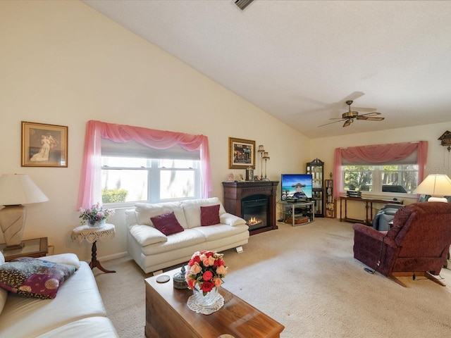 11536 Golden Rain Dr, New Port Richey, FL 34654 - living area with carpet floors, vaulted ceiling, a glass covered fireplace, and a ceiling fan