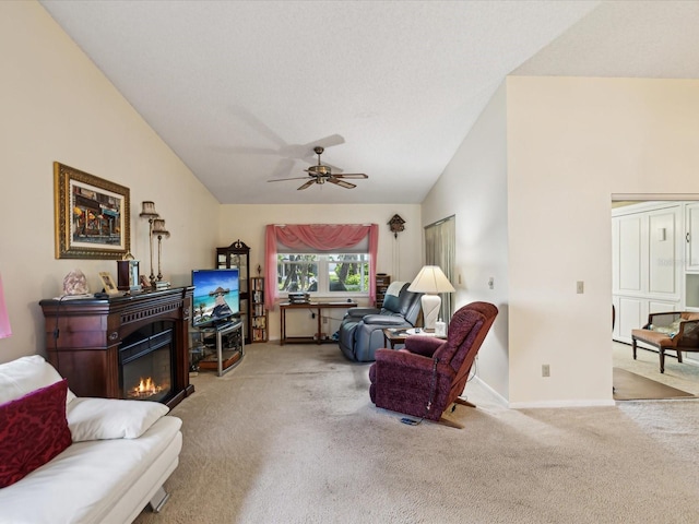 11536 Golden Rain Dr, New Port Richey, FL 34654 - living room with vaulted ceiling, carpet floors, ceiling fan, baseboards, and a glass covered fireplace