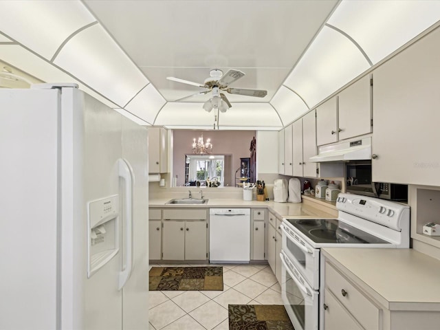 11536 Golden Rain Dr, New Port Richey, FL 34654 - kitchen with white appliances, under cabinet range hood, a sink, light tile patterned flooring, and ceiling fan