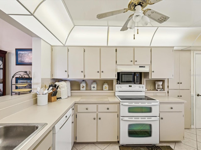 11536 Golden Rain Dr, New Port Richey, FL 34654 - kitchen featuring white appliances, light tile patterned floors, light countertops, ceiling fan, and a sink