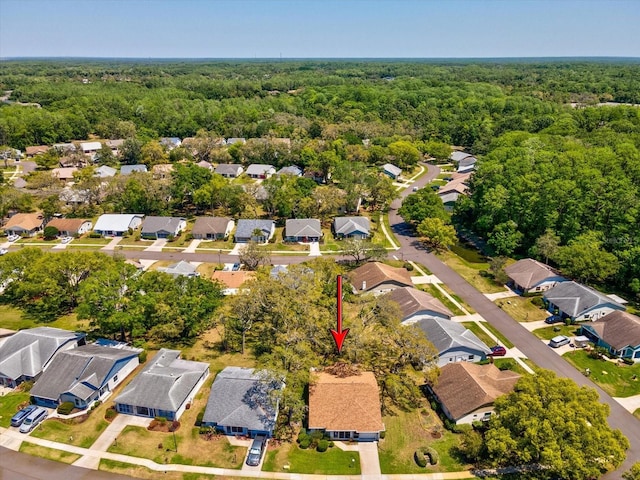 11536 Golden Rain Dr, New Port Richey, FL 34654 - aerial view of property and surrounding area featuring a forest and nearby suburban area