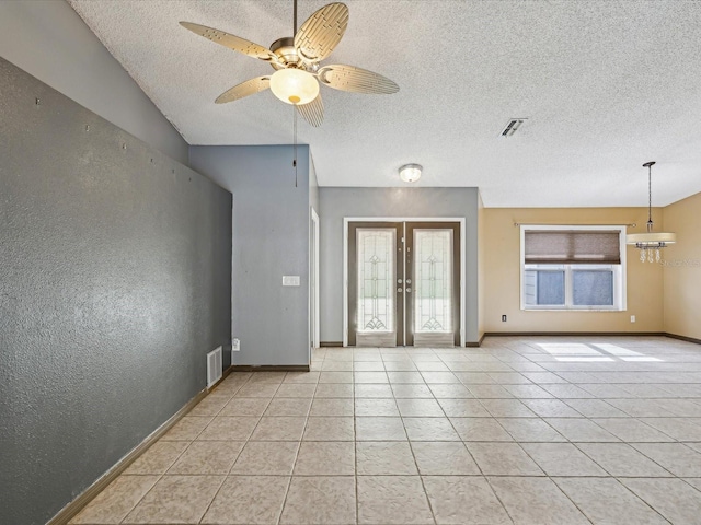5411 Joyner Ave, Spring Hill, FL 34608 - empty room featuring ceiling fan, french doors, a textured ceiling, and visible vents