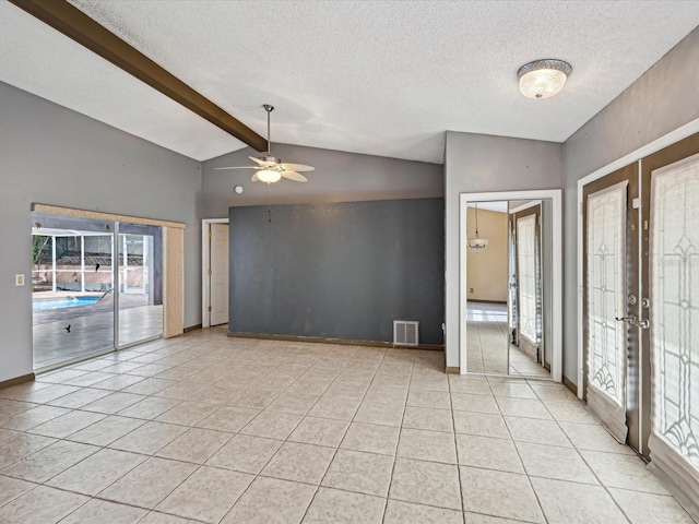 5411 Joyner Ave, Spring Hill, FL 34608 - empty room featuring lofted ceiling with beams, french doors, ceiling fan, and light tile patterned floors