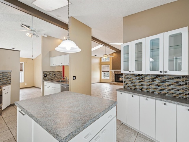5411 Joyner Ave, Spring Hill, FL 34608 - kitchen with a ceiling fan, light tile patterned floors, and tasteful backsplash