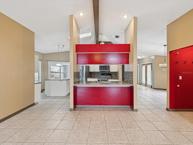 5411 Joyner Ave, Spring Hill, FL 34608 - kitchen featuring light tile patterned flooring, baseboards, lofted ceiling with beams, tasteful backsplash, and appliances with stainless steel finishes