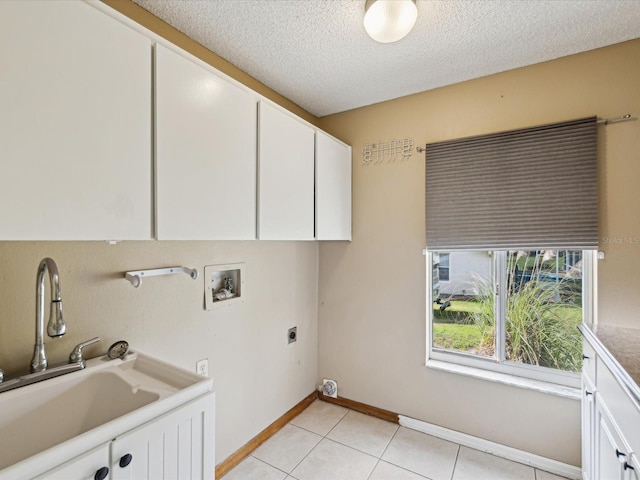 5411 Joyner Ave, Spring Hill, FL 34608 - laundry area with a sink, hookup for a washing machine, electric dryer hookup, cabinet space, and a textured ceiling