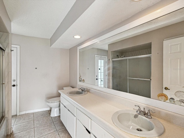 5411 Joyner Ave, Spring Hill, FL 34608 - bathroom with toilet, baseboards, an enclosed shower, and a sink