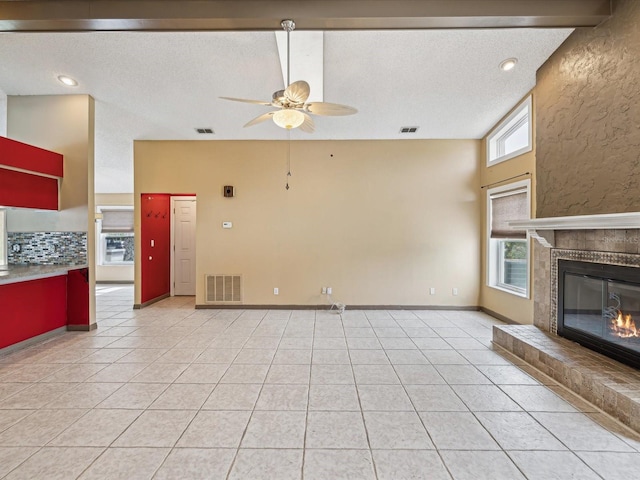 5411 Joyner Ave, Spring Hill, FL 34608 - unfurnished living room with visible vents, a ceiling fan, and light tile patterned floors