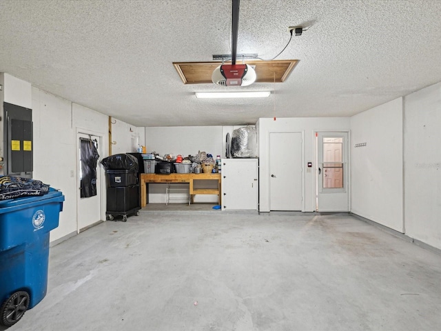 5411 Joyner Ave, Spring Hill, FL 34608 - garage featuring electric panel and a garage door opener