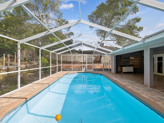 5411 Joyner Ave, Spring Hill, FL 34608 - outdoor pool featuring glass enclosure and a patio area