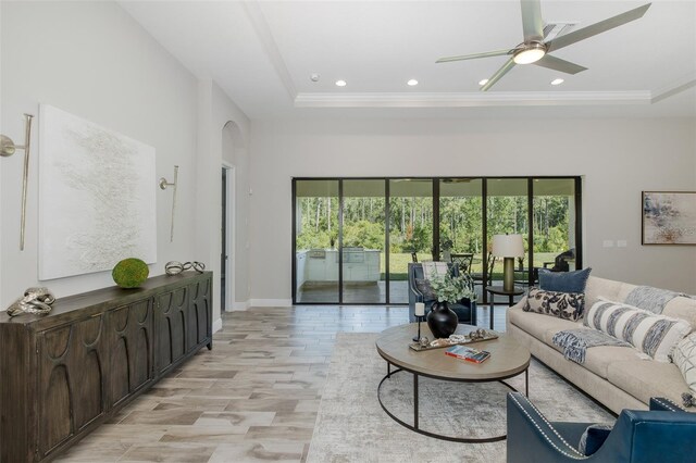 5070 Night Star Trl, Odessa, FL 33556 - living area with plenty of natural light, recessed lighting, ceiling fan, a tray ceiling, and ornamental molding