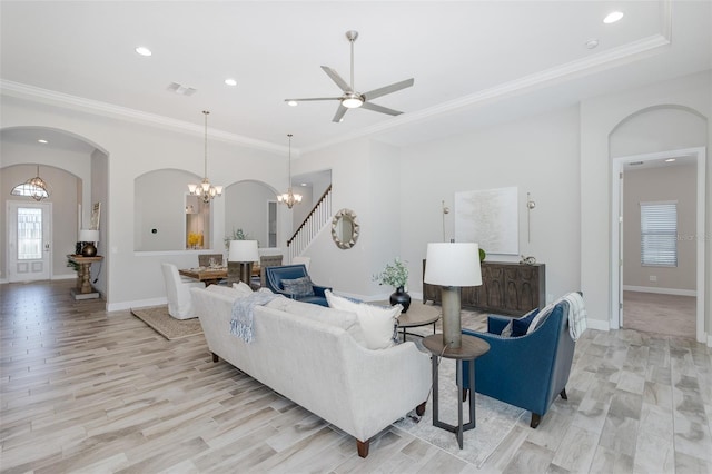5070 Night Star Trl, Odessa, FL 33556 - living room featuring recessed lighting, arched walkways, ornamental molding, a chandelier, and a ceiling fan