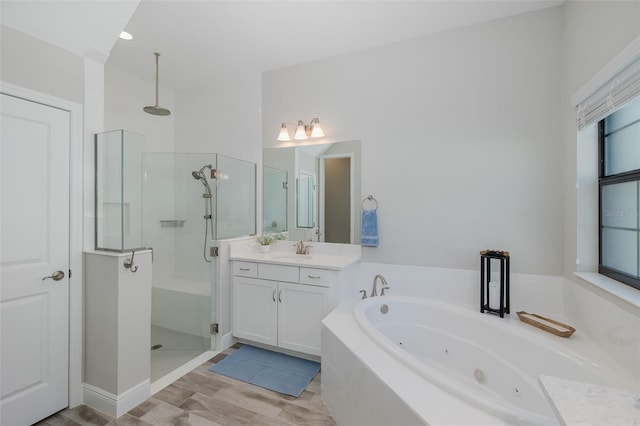5070 Night Star Trl, Odessa, FL 33556 - full bath with a stall shower, a whirlpool tub, and vanity