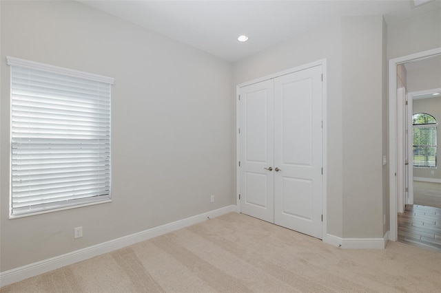 5070 Night Star Trl, Odessa, FL 33556 - unfurnished bedroom featuring carpet, a closet, baseboards, and recessed lighting