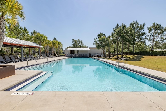 5070 Night Star Trl, Odessa, FL 33556 - community pool with a yard and a patio area