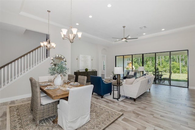 5070 Night Star Trl, Odessa, FL 33556 - dining area with recessed lighting, arched walkways, crown molding, light wood finished floors, and stairs