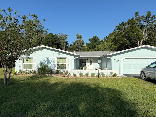 11648 Boynton Ln Unit 39Gb, New Port Richey, FL 34654 - single story home with stucco siding, a front yard, and a garage