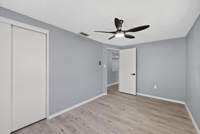 4607 Kennedy Dr, New Port Richey, FL 34652 - unfurnished bedroom featuring visible vents, baseboards, wood finished floors, and a closet