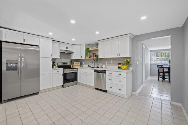 4607 Kennedy Dr, New Port Richey, FL 34652 - kitchen featuring open shelves, a sink, stainless steel appliances, light countertops, and under cabinet range hood