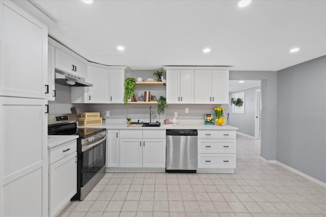 4607 Kennedy Dr, New Port Richey, FL 34652 - kitchen featuring under cabinet range hood, open shelves, light countertops, a sink, and appliances with stainless steel finishes