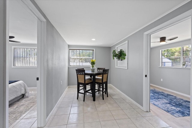 4607 Kennedy Dr, New Port Richey, FL 34652 - dining area featuring light tile patterned flooring, baseboards, ornamental molding, and recessed lighting