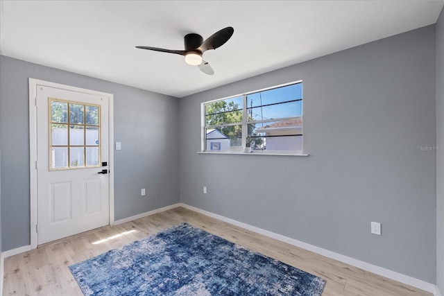 4607 Kennedy Dr, New Port Richey, FL 34652 - interior space featuring baseboards, a ceiling fan, wood finished floors, and plenty of natural light