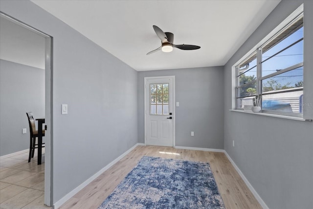 4607 Kennedy Dr, New Port Richey, FL 34652 - foyer with baseboards, light wood-style floors, and ceiling fan