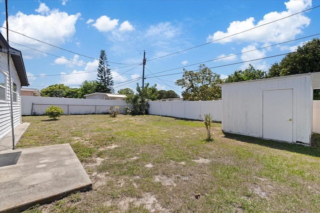 4607 Kennedy Dr, New Port Richey, FL 34652 - view of yard featuring a fenced backyard, an outbuilding, and a storage shed