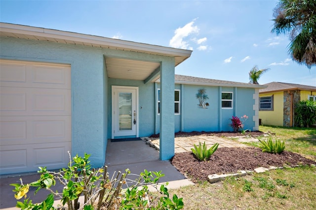 6432 Boatyard Dr, Hudson, FL 34667 - exterior space with an attached garage and stucco siding