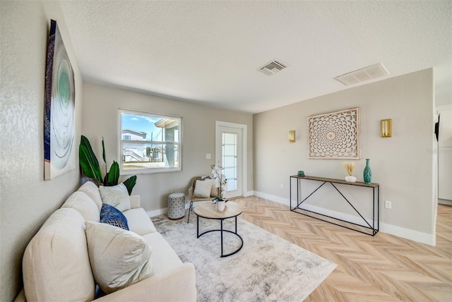 6432 Boatyard Dr, Hudson, FL 34667 - living room with baseboards, visible vents, and a textured ceiling