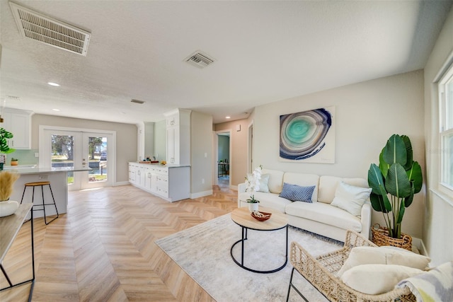 6432 Boatyard Dr, Hudson, FL 34667 - living room featuring visible vents, french doors, and recessed lighting