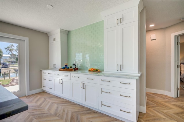 6432 Boatyard Dr, Hudson, FL 34667 - bar with a textured ceiling and baseboards