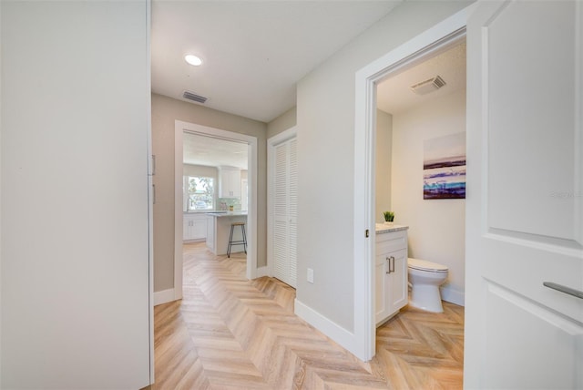 6432 Boatyard Dr, Hudson, FL 34667 - hallway featuring baseboards, visible vents, and recessed lighting