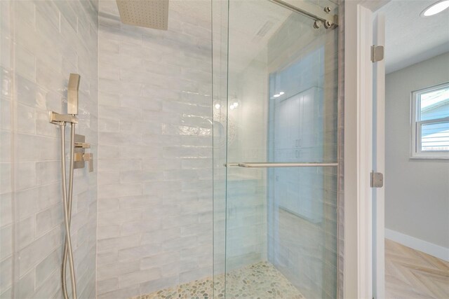 6432 Boatyard Dr, Hudson, FL 34667 - bathroom with baseboards and a stall shower