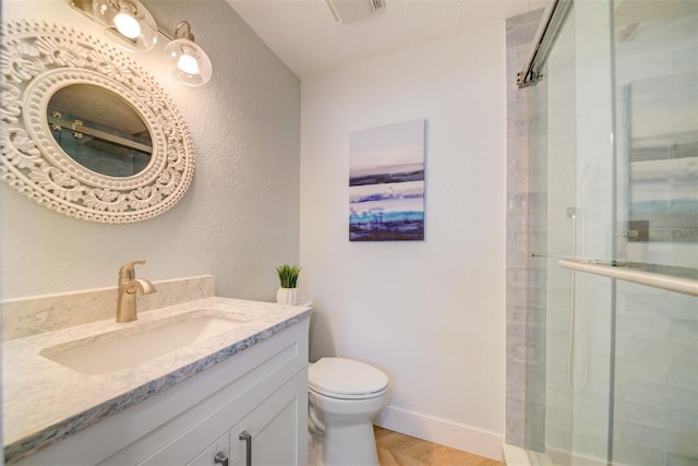 6432 Boatyard Dr, Hudson, FL 34667 - bathroom with tiled shower, toilet, a textured wall, vanity, and visible vents