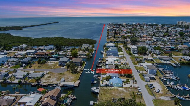 6432 Boatyard Dr, Hudson, FL 34667 - aerial view at dusk featuring a residential view and a water view