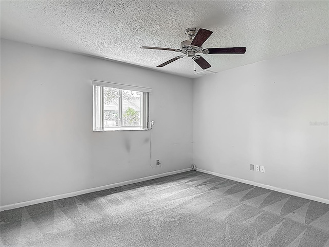 unfurnished room with carpet floors, a textured ceiling, and ceiling fan