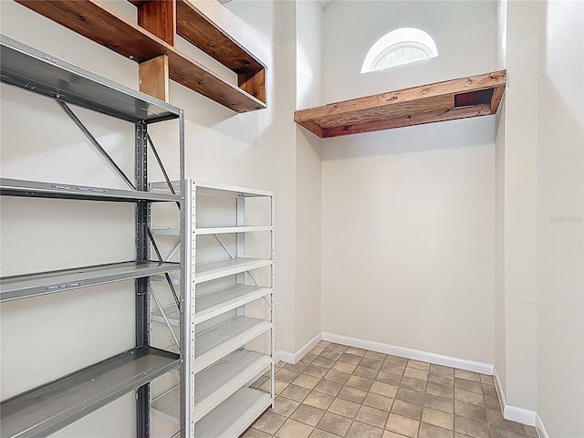 spacious closet with tile patterned flooring