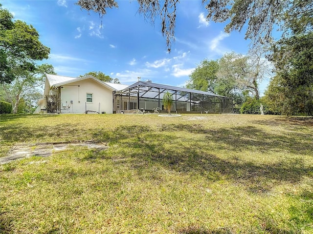 view of yard with a lanai
