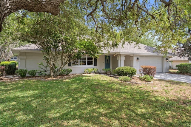 6095 W Douneray Loop, Crystal River, FL 34429 - ranch-style home featuring an attached garage, a front yard, and stucco siding