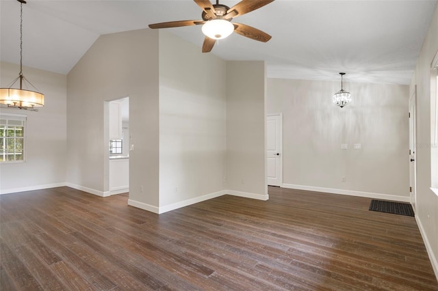 6095 W Douneray Loop, Crystal River, FL 34429 - spare room with high vaulted ceiling, dark wood finished floors, baseboards, and ceiling fan with notable chandelier