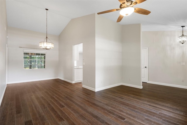 6095 W Douneray Loop, Crystal River, FL 34429 - spare room featuring high vaulted ceiling, baseboards, dark wood-style floors, and ceiling fan with notable chandelier