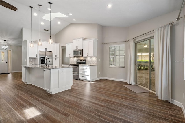 6095 W Douneray Loop, Crystal River, FL 34429 - kitchen featuring high vaulted ceiling, tasteful backsplash, white cabinetry, baseboards, and appliances with stainless steel finishes