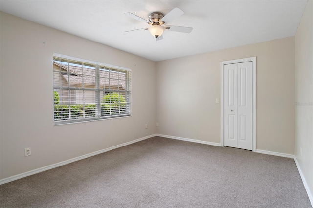 6095 W Douneray Loop, Crystal River, FL 34429 - empty room with baseboards, carpet flooring, and ceiling fan