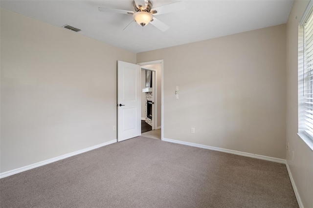 6095 W Douneray Loop, Crystal River, FL 34429 - carpeted spare room featuring visible vents, a ceiling fan, and baseboards