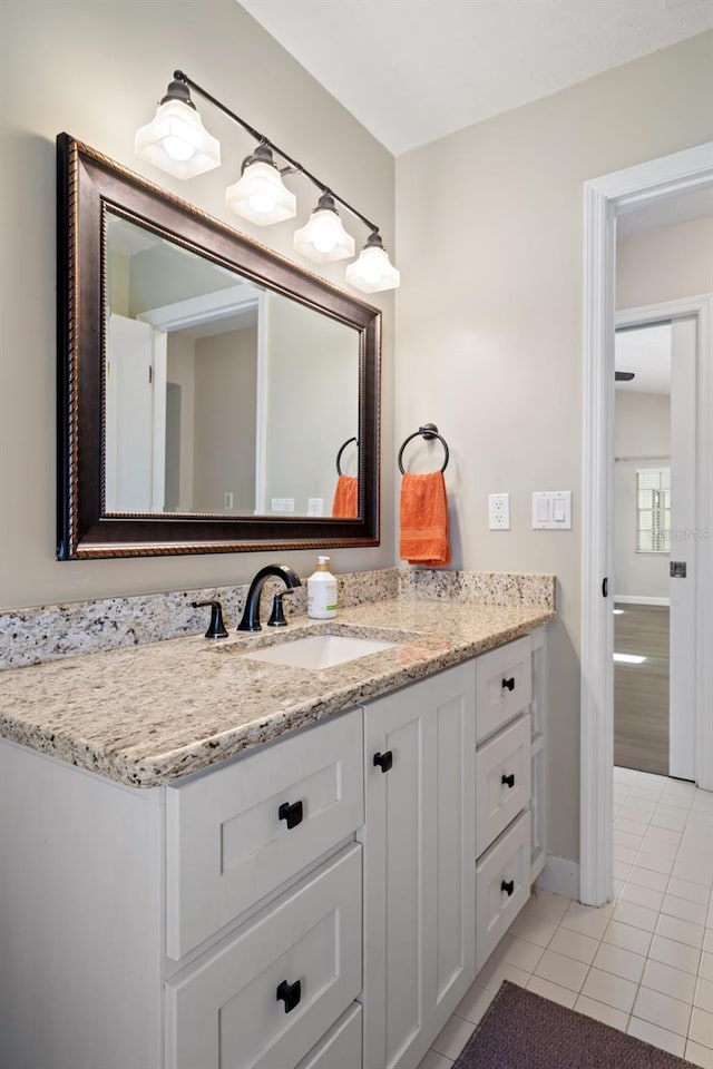 6095 W Douneray Loop, Crystal River, FL 34429 - bathroom with baseboards, tile patterned floors, and vanity